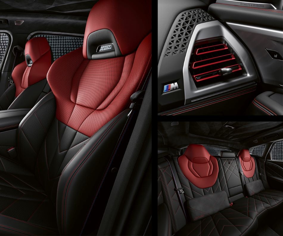 Detail of front seats, clad in exclusive BMW Individual Fiona Red & Black Merino Leather with exclusive M Signature Trim and red stitching and accents. Detail of red accented vent. Detail of rear M Lounge with exclusive XM pillows in Valley Auto World BMW | Fayetteville NC